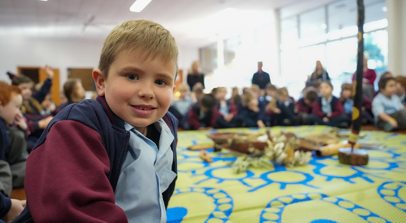 Student smiling at indigenous awareness event at St Finbar’s Catholic Primary Glenbrook
