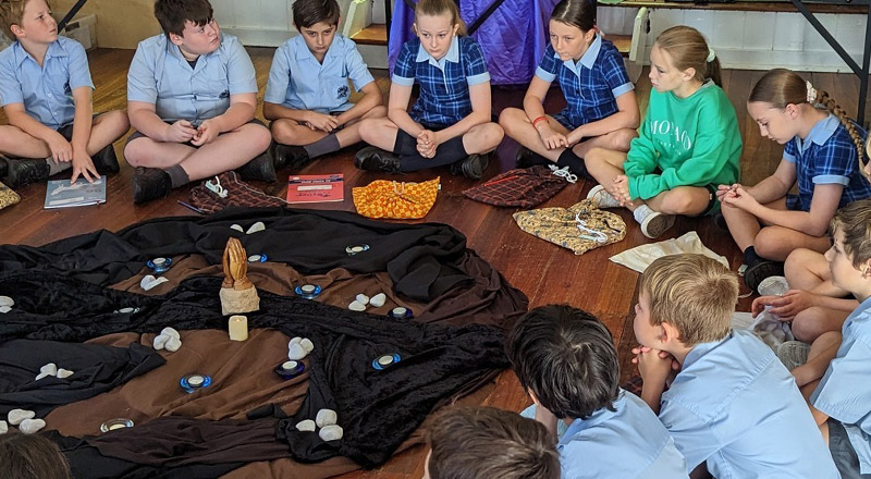 Students sitting together on the floor at St Finbar’s Catholic Primary Glenbrook