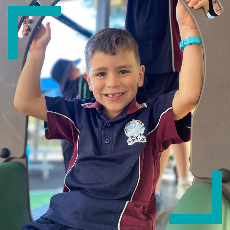 Student playing on the playground at St Finbar’s Catholic Primary Glenbrook