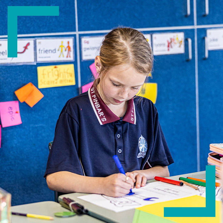 Student at her desk completing a worksheet at St Finbar's Primary School Glenbrook