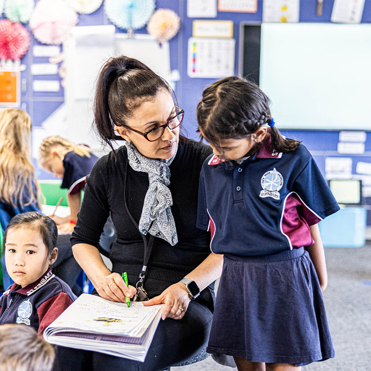 Teacher with student at St Finbar’s Catholic Primary Glenbrook