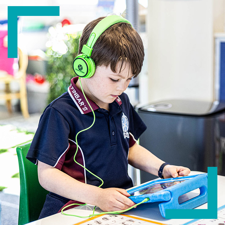 Student using learning tablet at St Finbar’s Catholic Primary Glenbrook