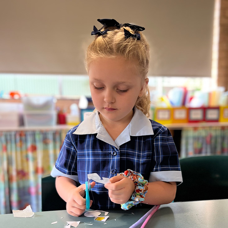 Student creating artwork at St Finbar's Primary School Glenbrook