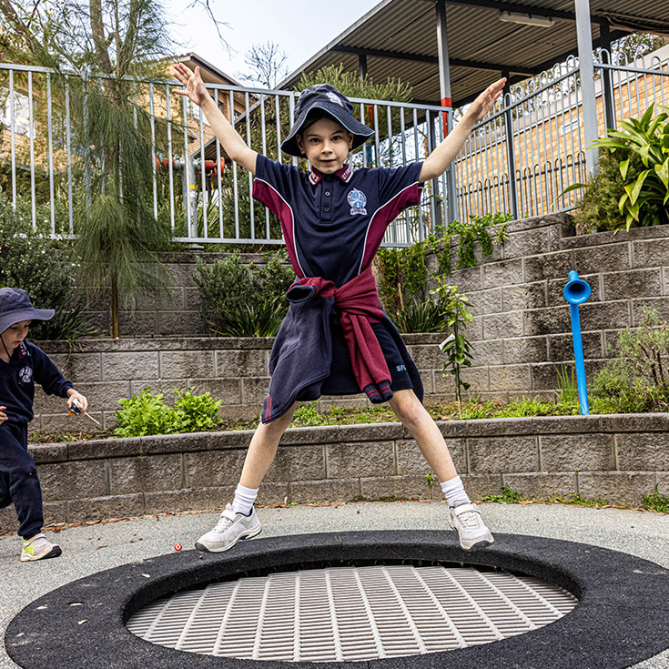 Student at St Finbar’s Catholic Primary Glenbrook jumping on a trampoline