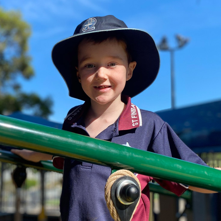 Students playing on play equipment at St Finbar’s Catholic Primary Glenbrook